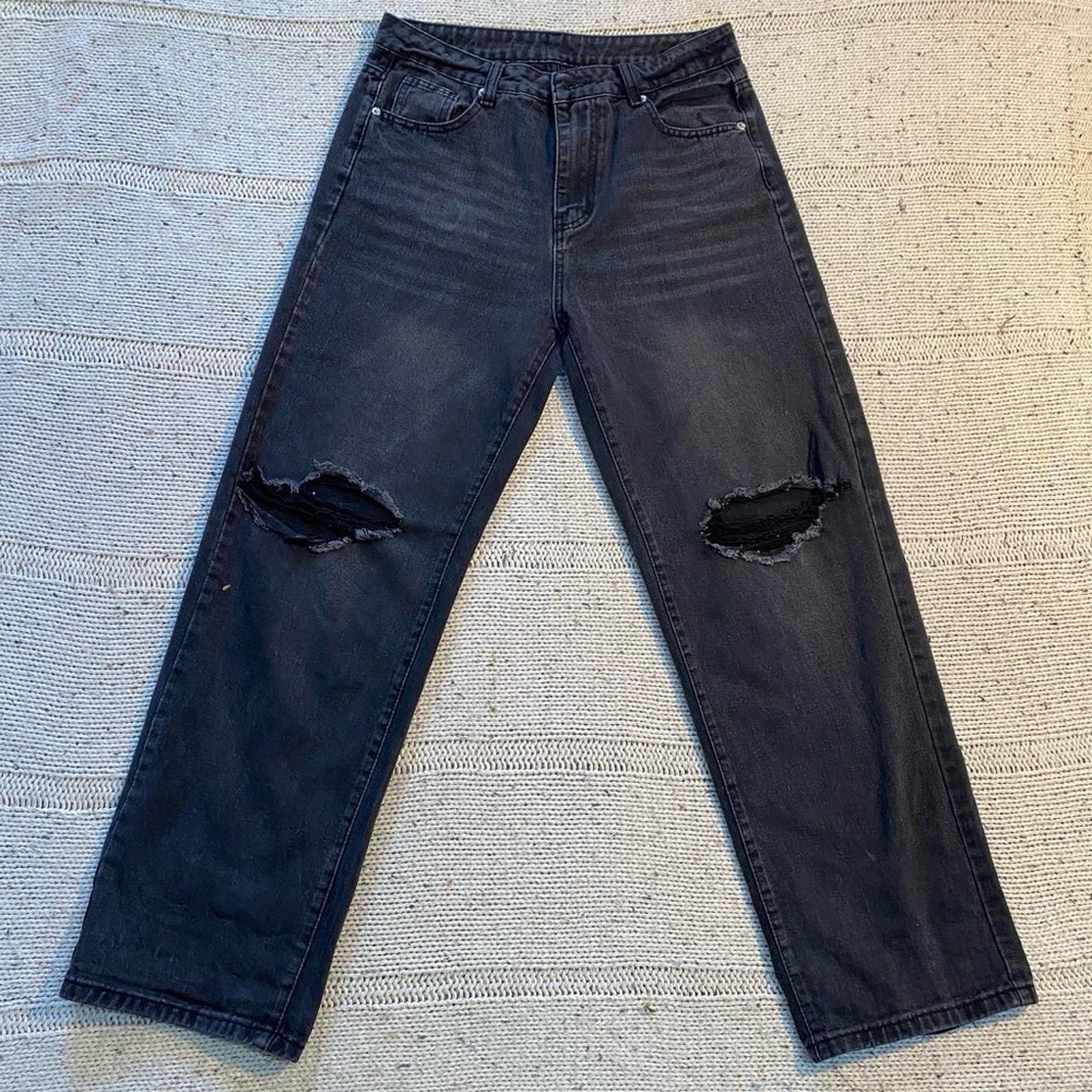 Black ripped jeans with a super loose flowy wide leg